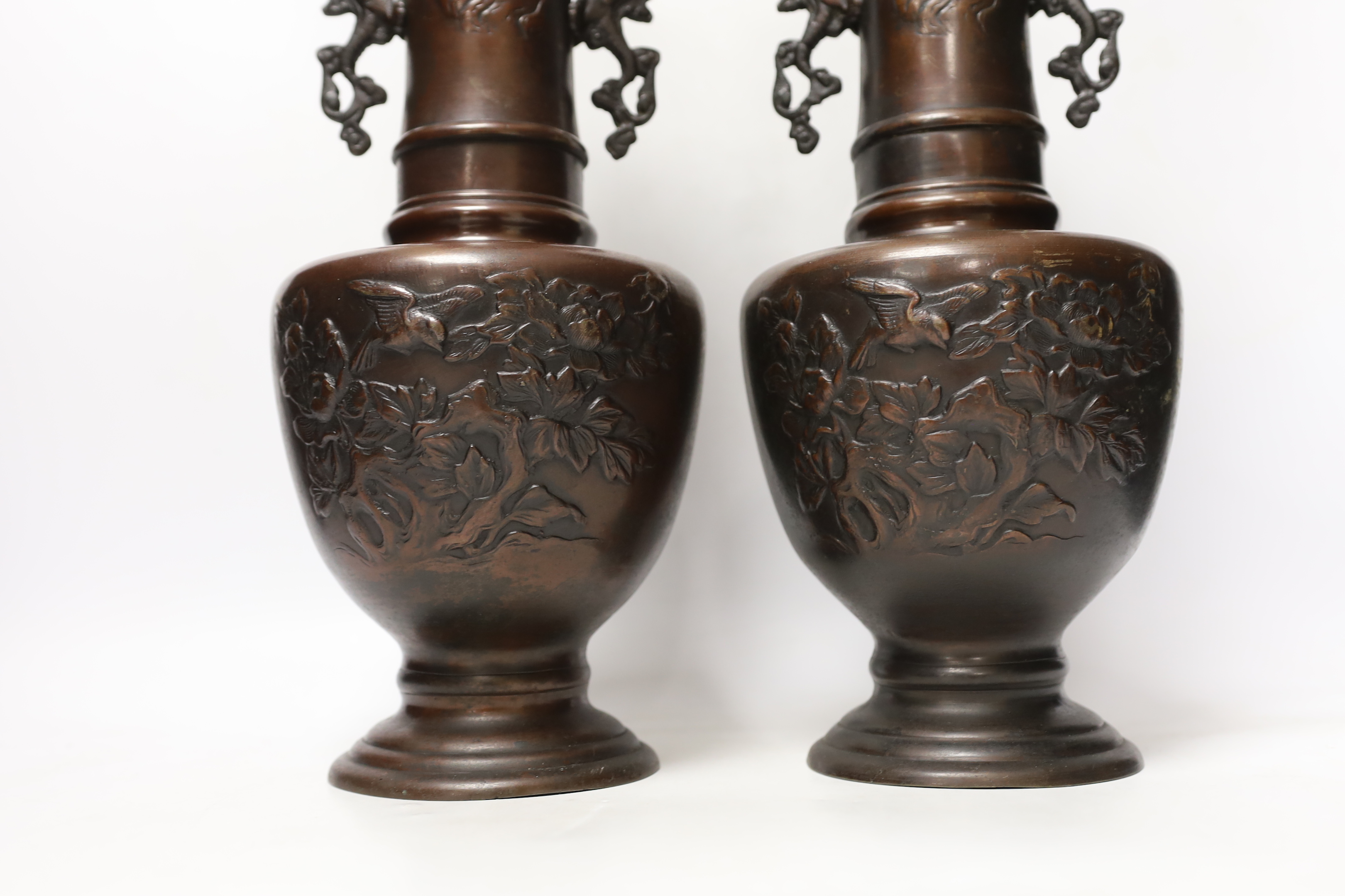 A pair of Japanese bronze vases, 38cm high